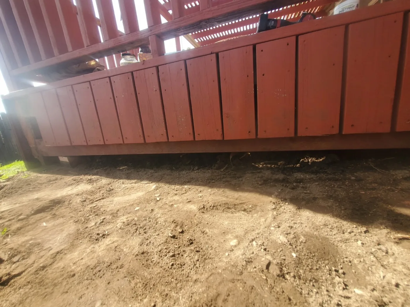 After: A rebuilt fence line set on fresh, graded ground